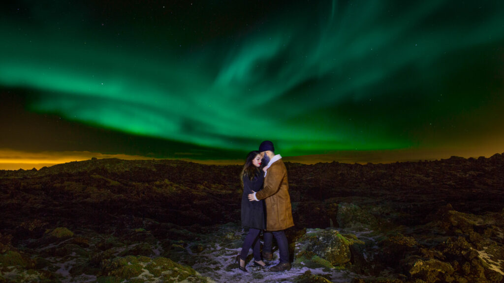 Couple beneath the northern lights